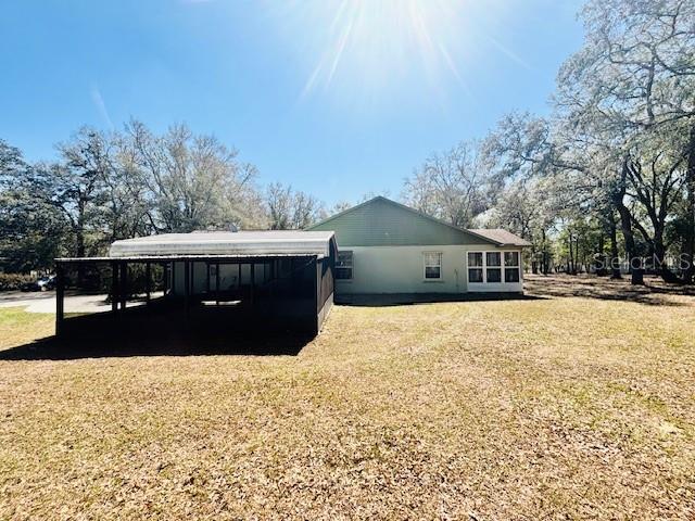 view of property exterior with a lawn