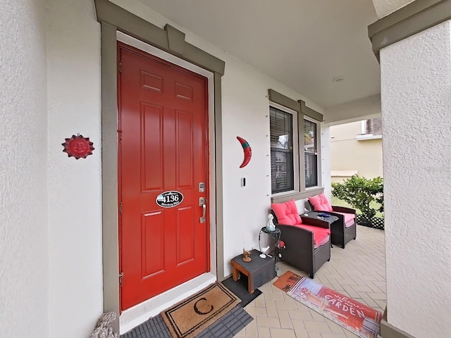 doorway to property with stucco siding