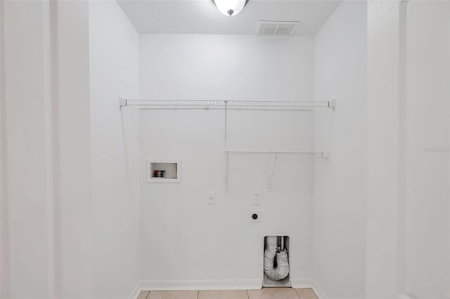 laundry area featuring light tile patterned floors, laundry area, washer hookup, visible vents, and electric dryer hookup
