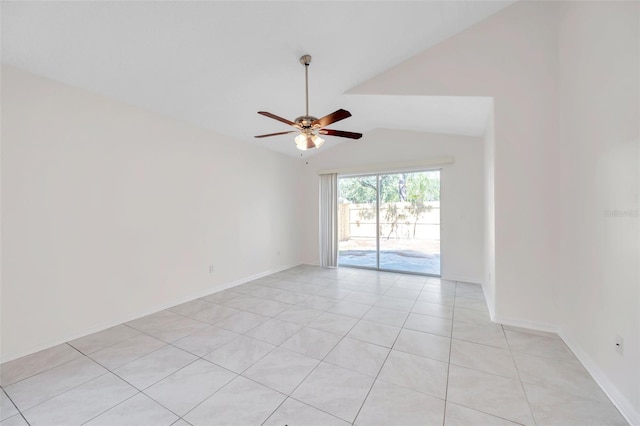 empty room with a ceiling fan, vaulted ceiling, baseboards, and light tile patterned floors