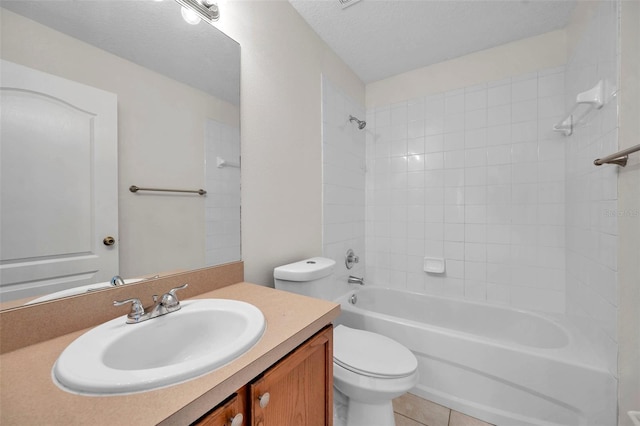 bathroom featuring bathing tub / shower combination, toilet, tile patterned flooring, a textured ceiling, and vanity