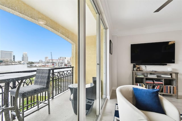 balcony with a view of city and a water view