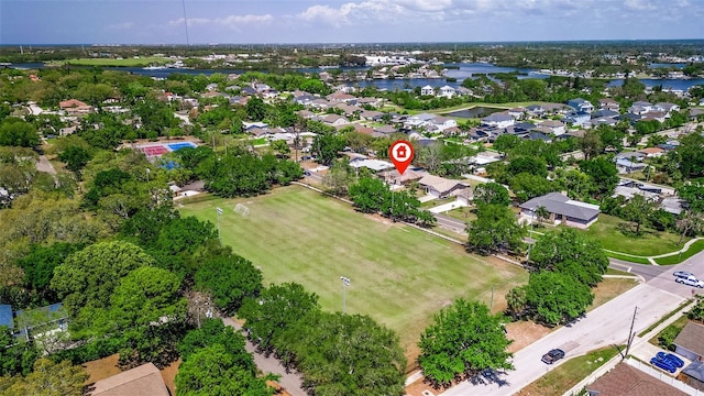 drone / aerial view with a residential view and a water view