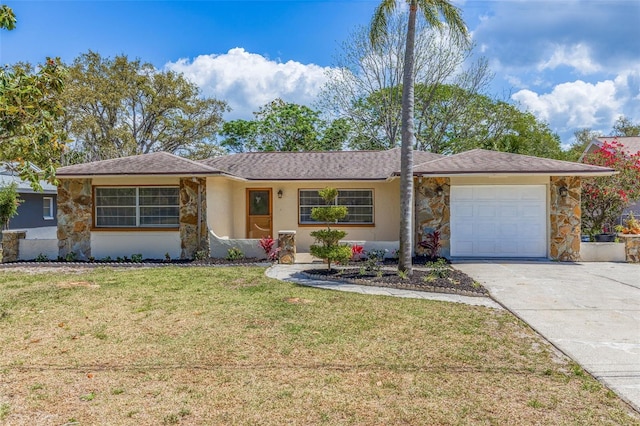 ranch-style house featuring an attached garage, stucco siding, a front yard, and concrete driveway