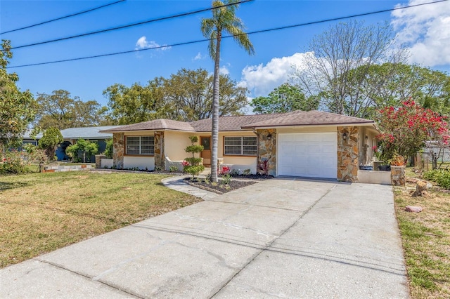 single story home with a garage, driveway, stone siding, and a front yard