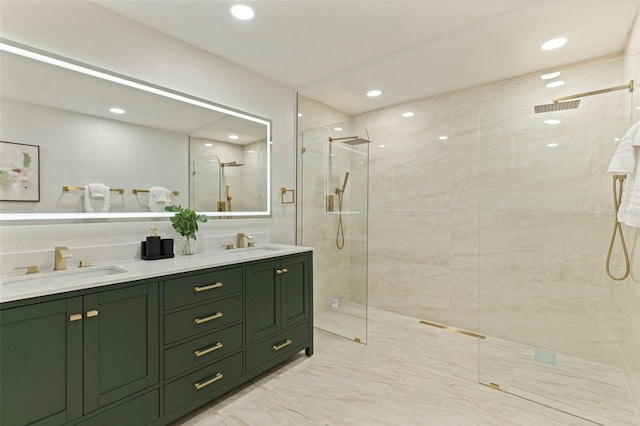 full bath featuring a sink, recessed lighting, double vanity, and a stall shower