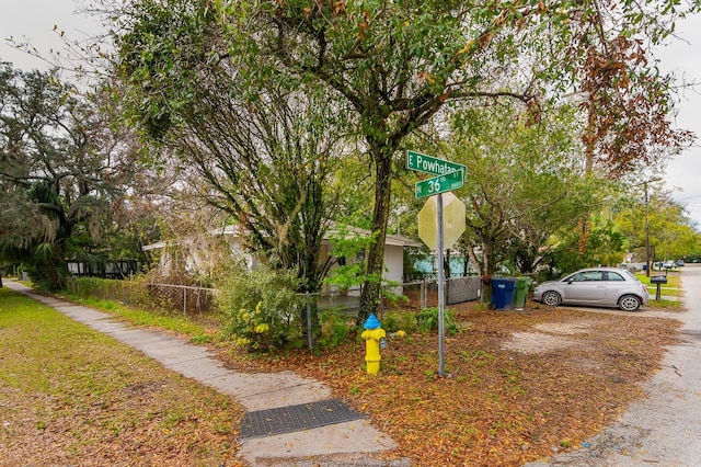 view of home's community with fence