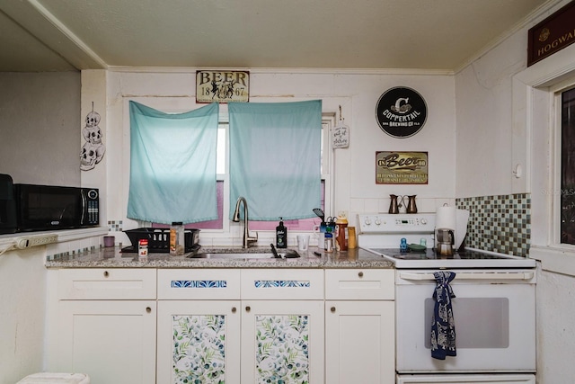 kitchen with electric range, white cabinets, crown molding, black microwave, and a sink