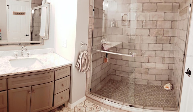 full bath featuring a shower stall and vanity