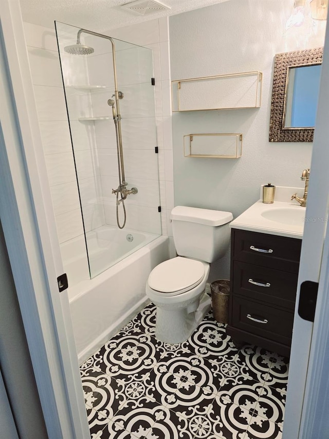 bathroom featuring visible vents, toilet, vanity, tile patterned flooring, and shower / bathtub combination