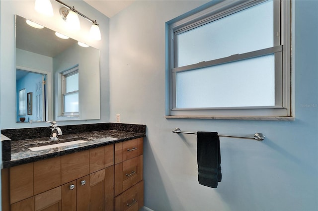 bathroom with vanity and a healthy amount of sunlight