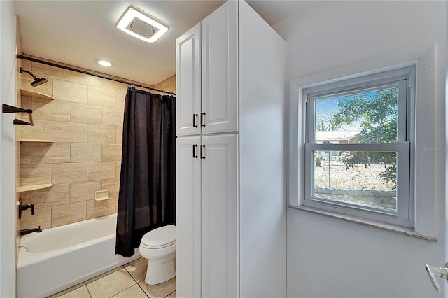 full bath featuring shower / tub combo with curtain, toilet, and tile patterned floors