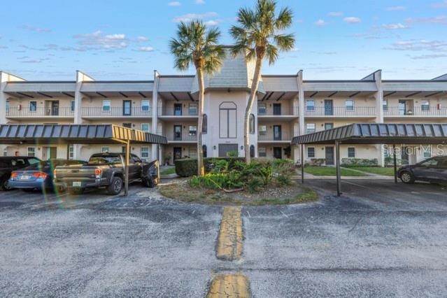 view of property featuring covered parking