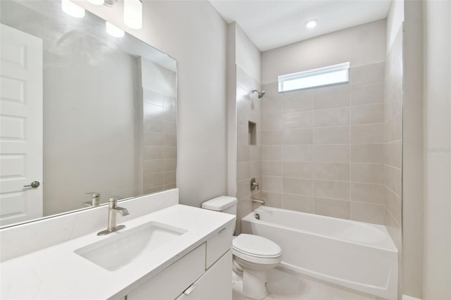 bathroom featuring toilet, vanity, and shower / bathing tub combination