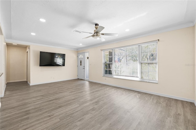 1131 60th Ave S, Saint Petersburg, FL 33705 - unfurnished living room with wood finished floors, a ceiling fan, baseboards, recessed lighting, and ornamental molding