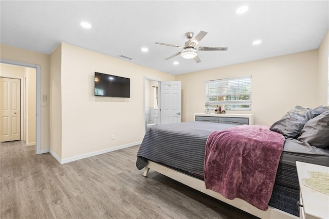 1131 60th Ave S, Saint Petersburg, FL 33705 - bedroom featuring light wood-type flooring, baseboards, recessed lighting, ensuite bathroom, and a ceiling fan