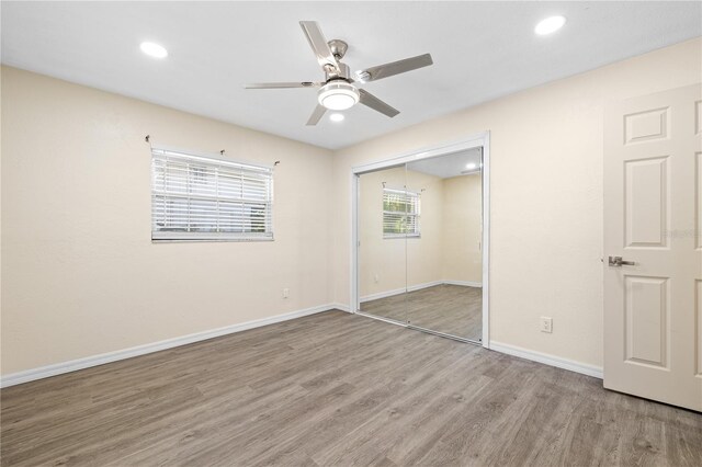 1131 60th Ave S, Saint Petersburg, FL 33705 - unfurnished bedroom featuring wood finished floors, a closet, baseboards, recessed lighting, and ceiling fan