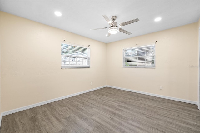 1131 60th Ave S, Saint Petersburg, FL 33705 - unfurnished room with wood finished floors, ceiling fan, baseboards, and recessed lighting