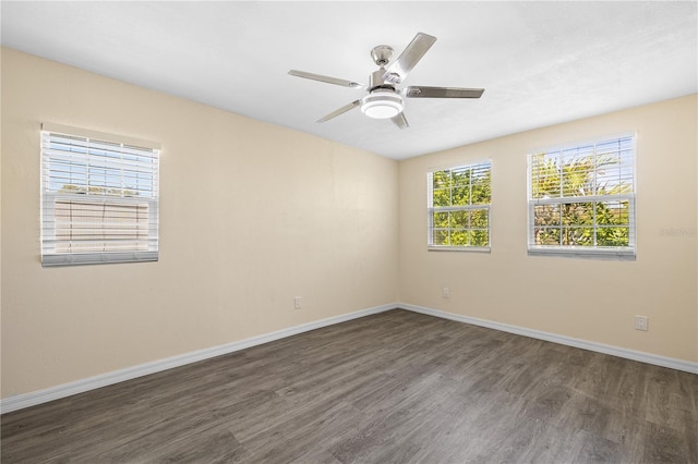 1131 60th Ave S, Saint Petersburg, FL 33705 - unfurnished room with wood finished floors, baseboards, and a ceiling fan