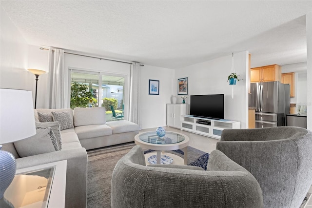 living area featuring a textured ceiling