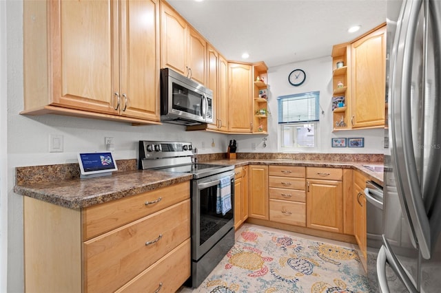 kitchen with dark countertops, stainless steel appliances, light brown cabinetry, open shelves, and recessed lighting