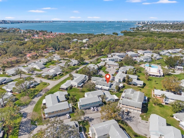 drone / aerial view featuring a residential view and a water view