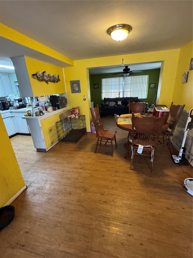 dining room with wood finished floors