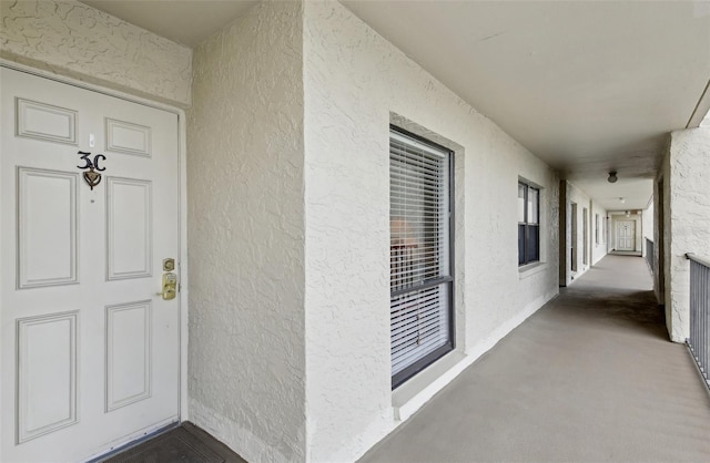 doorway to property with stucco siding