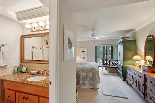 bathroom with ceiling fan, vanity, and crown molding