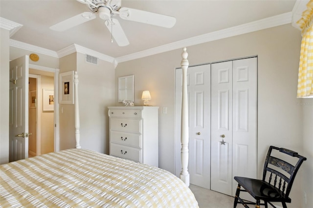 bedroom featuring crown molding, a closet, light colored carpet, visible vents, and ceiling fan