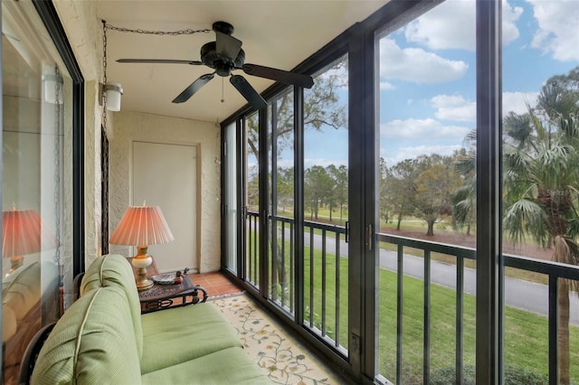 sunroom featuring ceiling fan