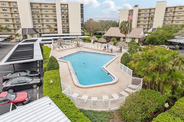 pool featuring a patio area and fence