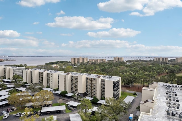 aerial view featuring a view of city and a water view