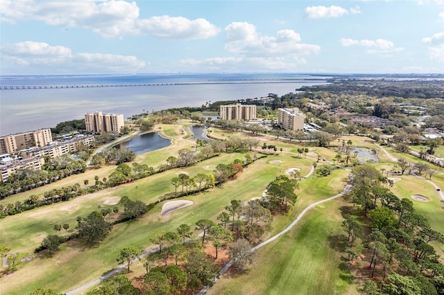 bird's eye view featuring view of golf course, a water view, and a city view