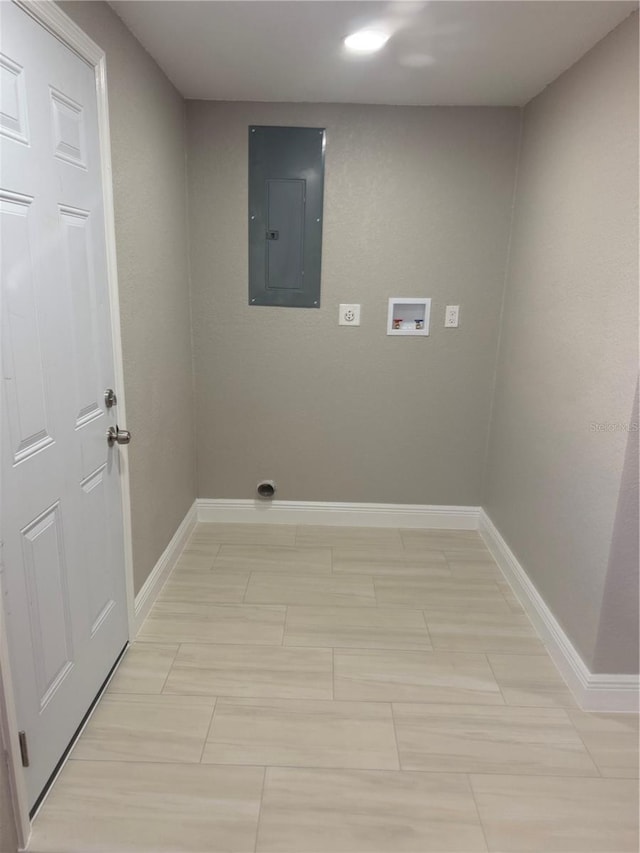 clothes washing area featuring hookup for a washing machine, laundry area, baseboards, electric panel, and electric dryer hookup