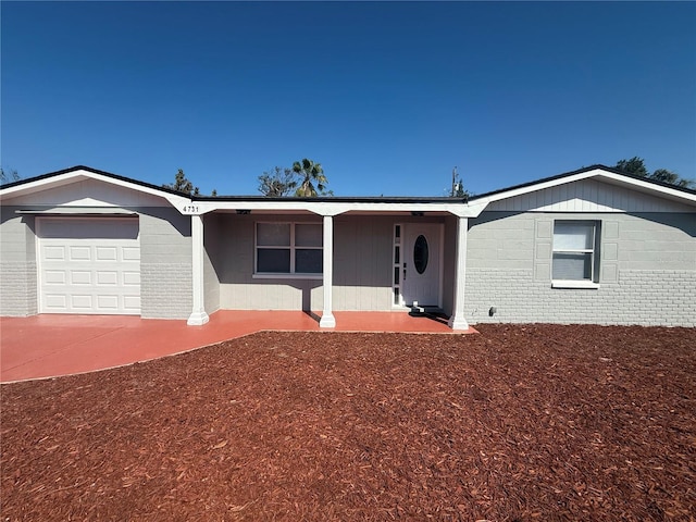 ranch-style home with brick siding and an attached garage