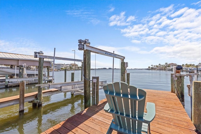 dock area featuring a water view and boat lift