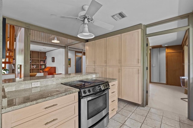 kitchen featuring stainless steel electric stove, a ceiling fan, visible vents, light stone countertops, and light brown cabinetry