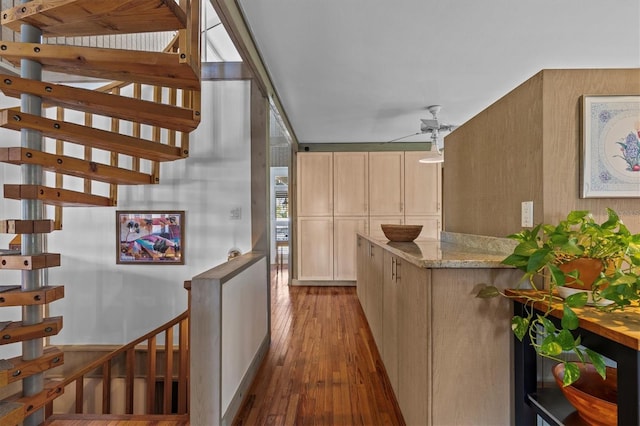 hallway with hardwood / wood-style flooring and an upstairs landing