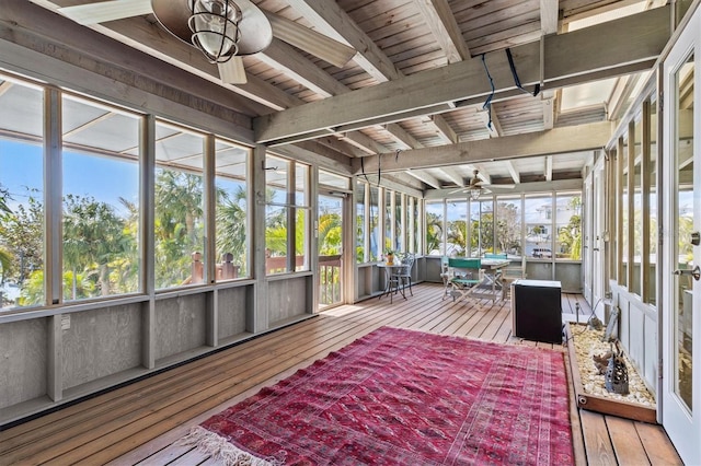 sunroom featuring wood ceiling, ceiling fan, and beamed ceiling