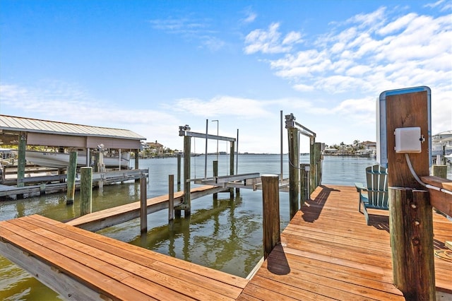 view of dock with a water view and boat lift