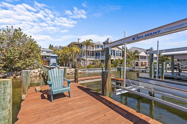 view of dock featuring a water view and boat lift