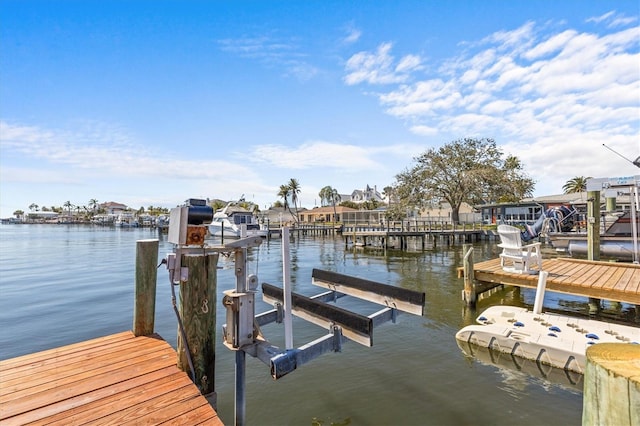 view of dock with a water view and boat lift