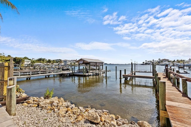 view of dock featuring a water view and boat lift