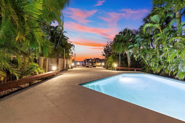 view of pool featuring a patio area and fence