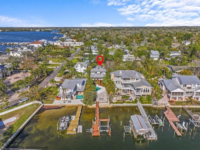 birds eye view of property featuring a residential view and a water view