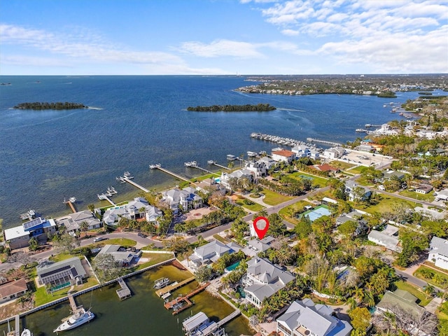 birds eye view of property featuring a residential view and a water view