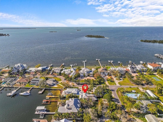 bird's eye view with a water view and a residential view