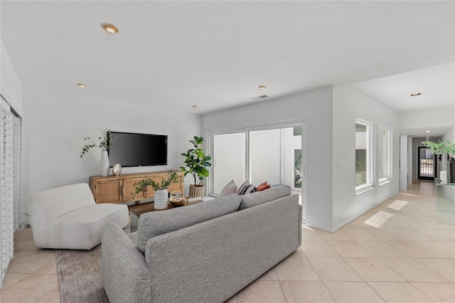 3101 W El Prado Blvd Unit B, Tampa, FL 33629 - living area with light tile patterned floors, recessed lighting, and baseboards