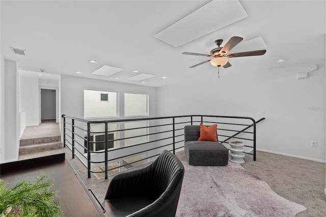 3101 W El Prado Blvd Unit B, Tampa, FL 33629 - corridor with an upstairs landing, a skylight, baseboards, recessed lighting, and carpet flooring
